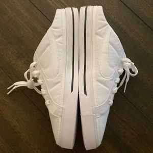 Nike white slip on sneakers. Women’s size 8 1/2.